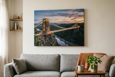 canvas print bristol – a gallery-wrapped canvas print of Clifton Suspension Bridge at dusk hung above a sofa