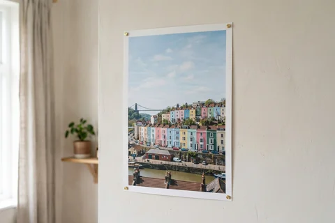 poster print bristol – an unframed poster print of the coloured houses of Cliftonwood pinned to a pale wall