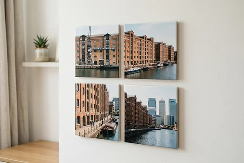 mixpix photo tiles canary wharf – four 20×20 cm photo tiles of West India Quay's warehouses arranged in a cluster on a white wall with no visible fixings