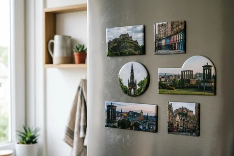 mixmags photo magnets edinburgh – several photo magnets of Edinburgh landmarks in different shapes on a fridge door
