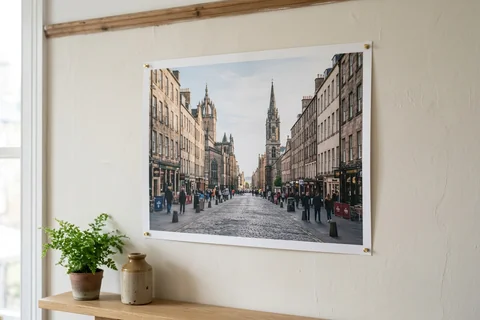 poster print edinburgh – an unframed poster print of the Royal Mile pinned to a pale wall