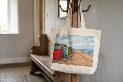 photo tote bag edinburgh – a cloth tote bag printed with a photograph of Portobello beach huts hanging on a hallway hook