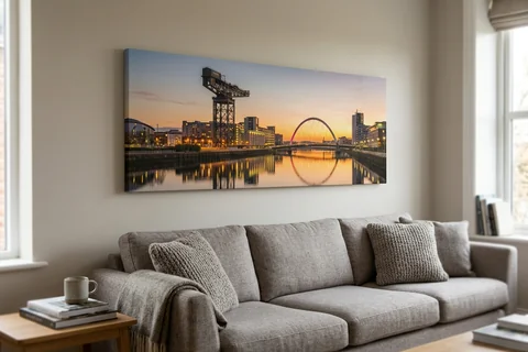 panoramic canvas print glasgow – a wide panoramic canvas of the Clyde from the Squinty Bridge at sunset hung above a long sofa