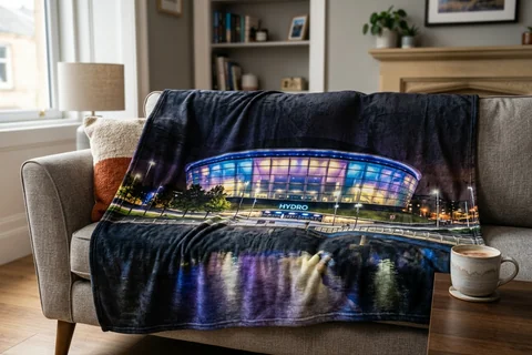 photo blanket glasgow – a plush blanket printed edge to edge with the Hydro at night draped over a sofa