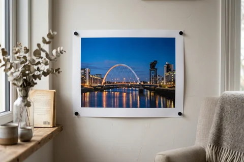 poster print glasgow – an unframed poster print of the Clyde Arc at dusk pinned to a pale wall