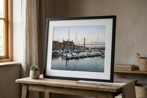 framed photo print hull – a framed print of Hull Marina with a white mount and black frame standing on a console table
