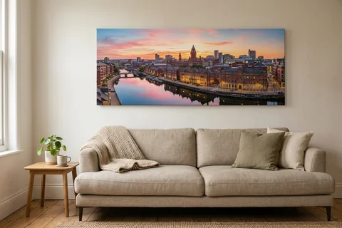 panoramic canvas print leeds – a wide panoramic canvas of the River Aire at sunset hung above a long sofa