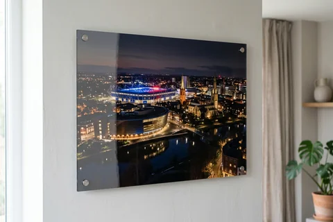 acrylic photo print leicester – a glossy acrylic print of the city skyline at night mounted off a pale wall