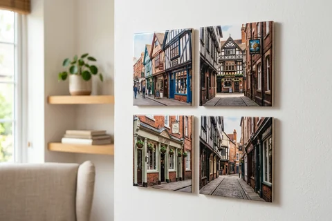 mixpix photo tiles leicester – four 20×20 cm photo tiles of the Lanes' shopfronts arranged in a cluster on a white wall with no visible fixings