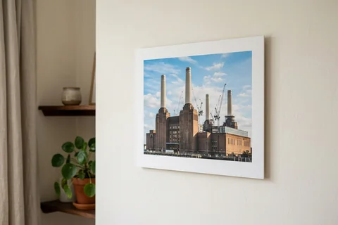 photo board print london – a frameless matte photo board of Battersea Power Station hanging flush on a pale wall