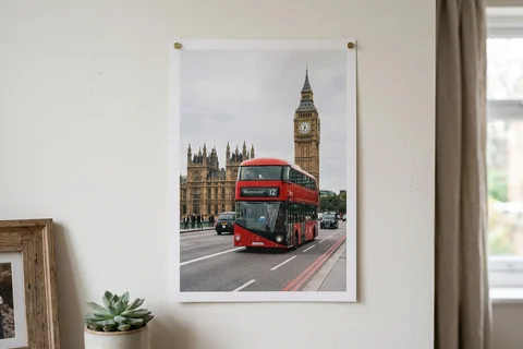 poster print london – an unframed poster print of a red London bus on Westminster Bridge pinned to a pale wall