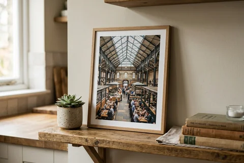 framed photo board manchester – a slim-framed photo board of Mackie Mayor market hall standing on a kitchen shelf