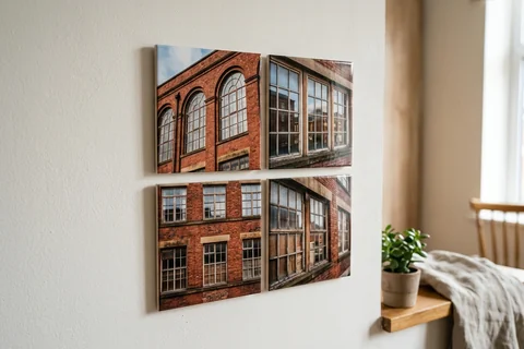 mixpix photo tiles manchester – four 20×20 cm photo tiles of Ancoats mill windows arranged in a cluster on a white wall with no visible fixings