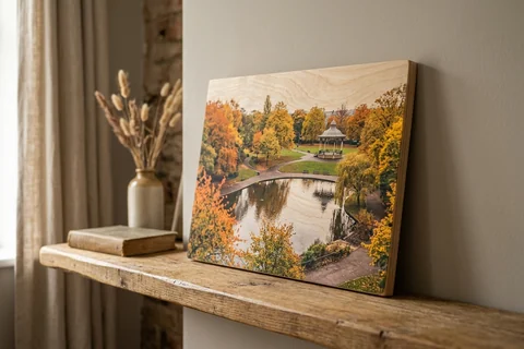 photo print on wood newcastle – a wood print of Leazes Park in autumn with the grain visible through the image, leaning on a shelf