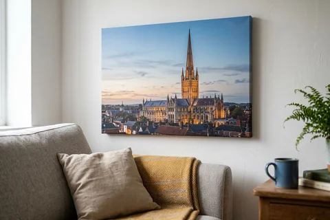 canvas print norwich – a gallery-wrapped canvas print of Norwich Cathedral spire at dusk hung above a sofa