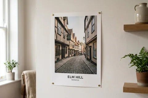 poster print norwich – an unframed poster print of Elm Hill's cobbles pinned to a pale wall