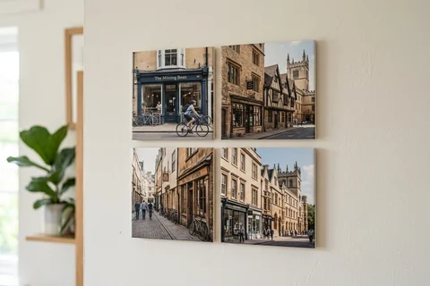 mixpix photo tiles oxford – four 20×20 cm photo tiles of Turl Street shopfronts arranged in a cluster on a white wall with no visible fixings