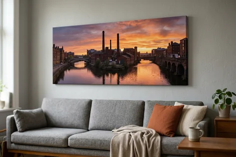 panoramic canvas print sheffield – a wide panoramic canvas of the River Don at sunset hung above a long sofa