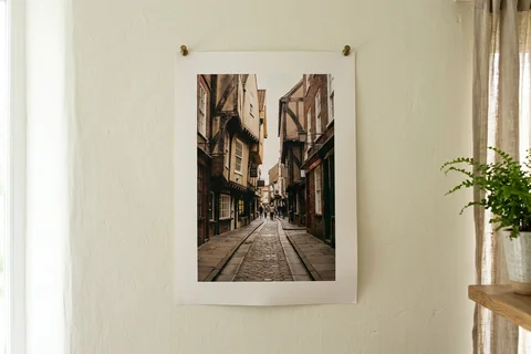 poster print york – an unframed poster print of the Shambles pinned to a pale wall