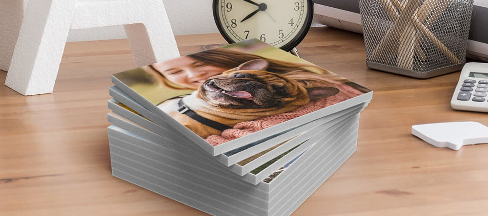What Are Photo Tiles. Stack of photo tiles with picture of dog.