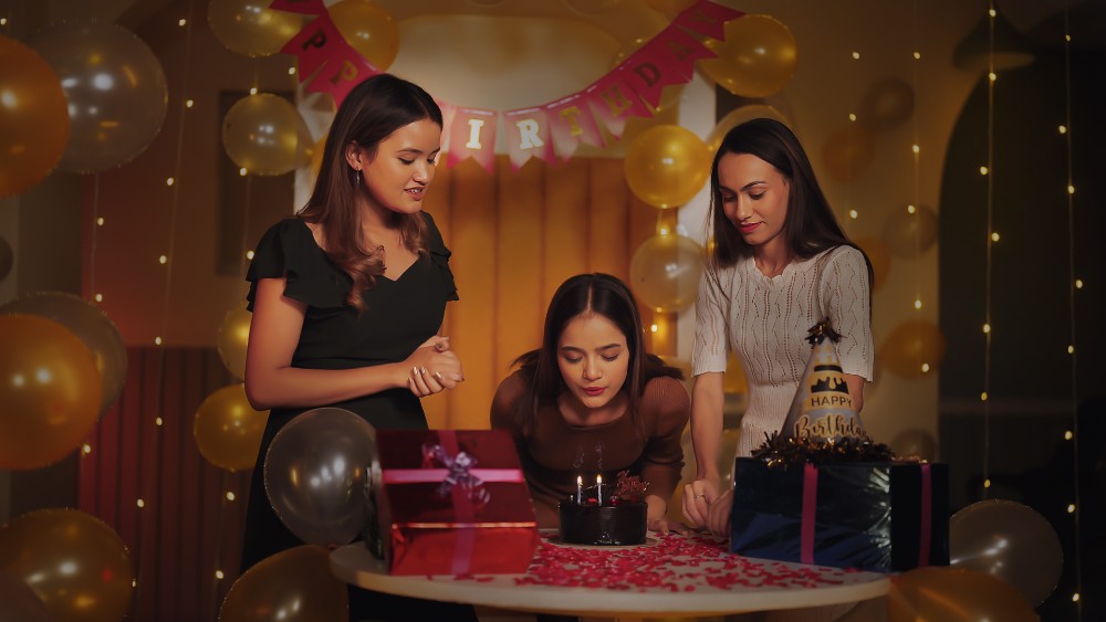 Birthday celebration with cake and balloons