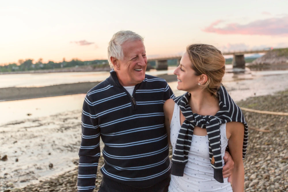 Father reading a book to his daughter, representing British literary tradition themes of father-daughter relationships